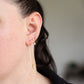 jane wearing her wren fine chain threader earrings with white cubic zirconia
