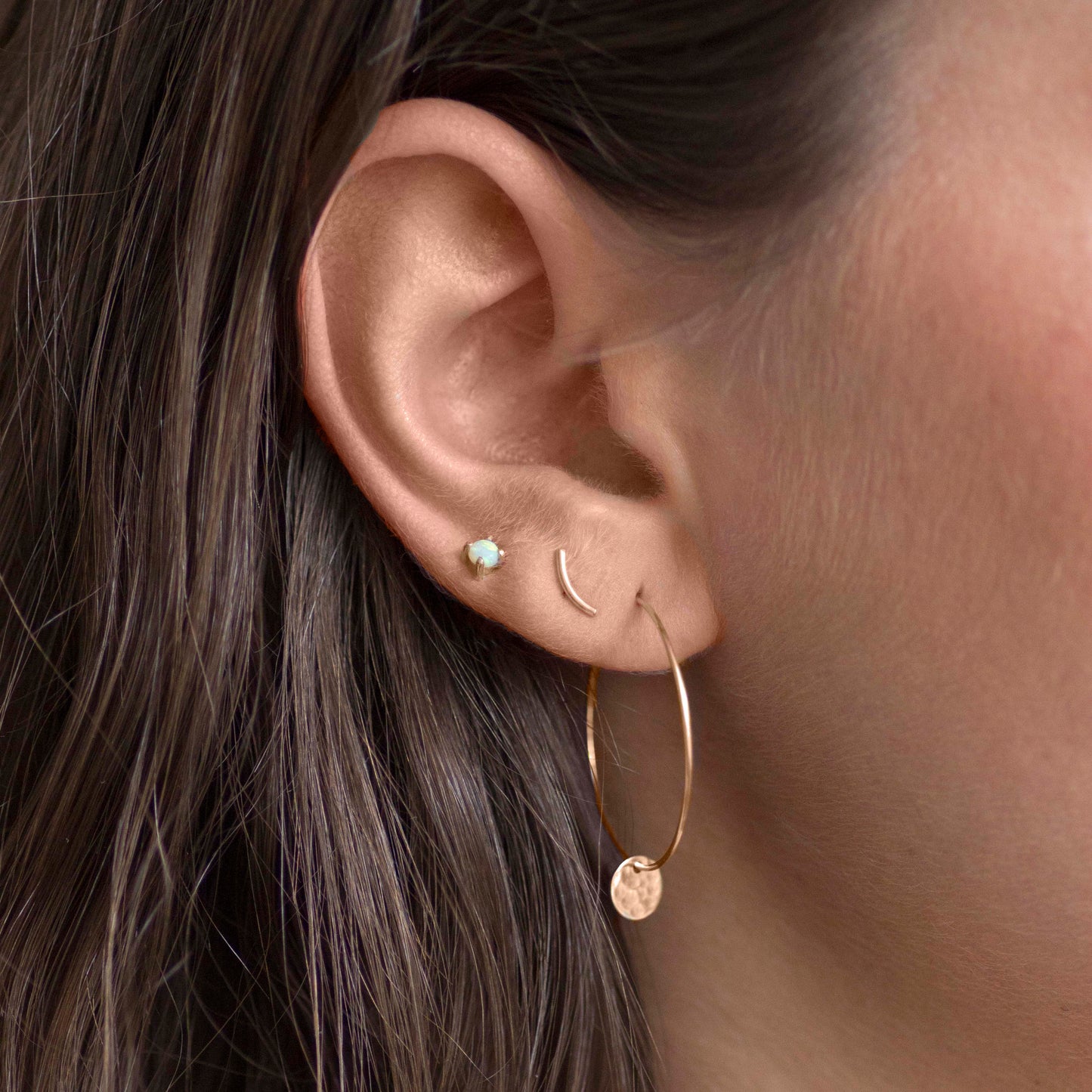 flora hoop, curve stud and australian opal stud in 14ct yellow gold by jane finch jewellery